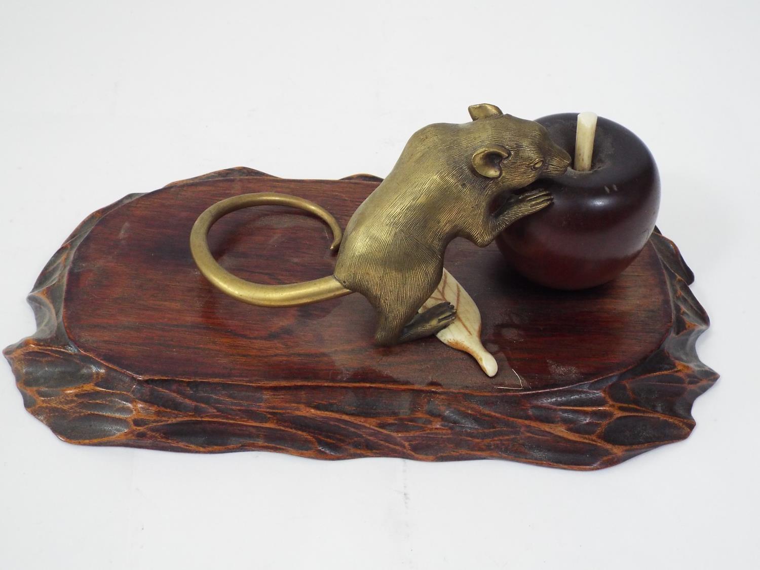 A Japanese group comprising a brass rat with gold tail, about to eat an apple, in turned wood, - Image 2 of 4