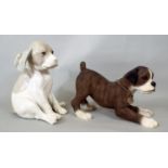 A German Porcelain figure of a seated puppy and a further resin playful Bulldog, 24cm