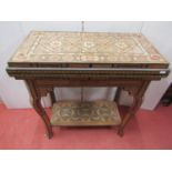 A Moroccan marquetry games table of rectangular form raised on four shaped supports with under