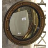 A small reproduction Regency style convex wall mirror with ebonised slip and ball surround, 39 cm in