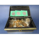 A tin box containing a miscellaneous collection of English coinage to include copper and nickel,