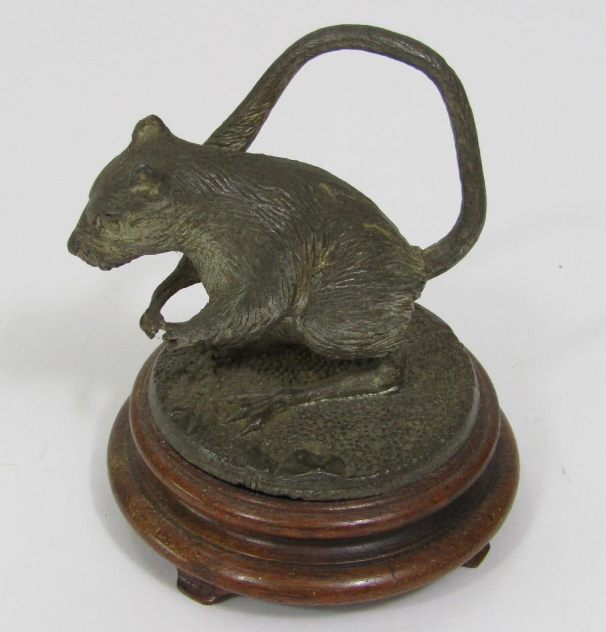 A cast figure of a rat standing on its hind legs raised on a circular hardwood base, 9 cm in height - Image 2 of 2