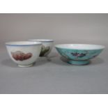 A pair of small oriental tea or wine bowls with polychrome painted decoration and six character