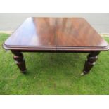 A Victorian mahogany extending dining table with two additional leaves, raised on four octagonal