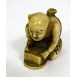 Meiji Period - Ivory Netsuke of a crouching man with a bale and a rat upon his back
