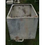 A reclaimed galvanised water tank of rectangular form 97 cm wide x 70 cm deep x 70 cm in height
