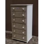 A small table top mahogany chest of six long drawers with button knob handles and painted finish, 30
