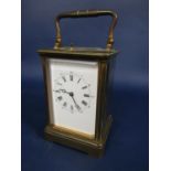 Brass cased repeater carriage clock, the enamel dial with roman and Arabic numerals, striking on a