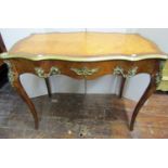 19th century French side of writing table, the shaped outline with cross-banded borders enclosing