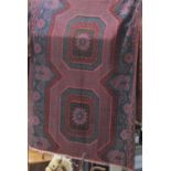 An unusual wool Sumak type rug, with star and floral decoration upon a geometric black ground, 270 x