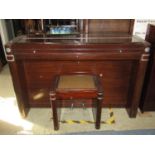 An Eavestaff "Minipiano" upright iron framed and overstrung in an Art Deco mahogany case, 85 keys