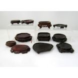 Eleven carved timber bases of various shapes and sizes for individual display/supports, 11cm and