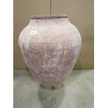 An old terracotta jar of shouldered oviform with drawn form 61 cm high