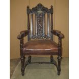 A pair of Victorian carved oak open armchairs with acanthus and further detail, brown leather