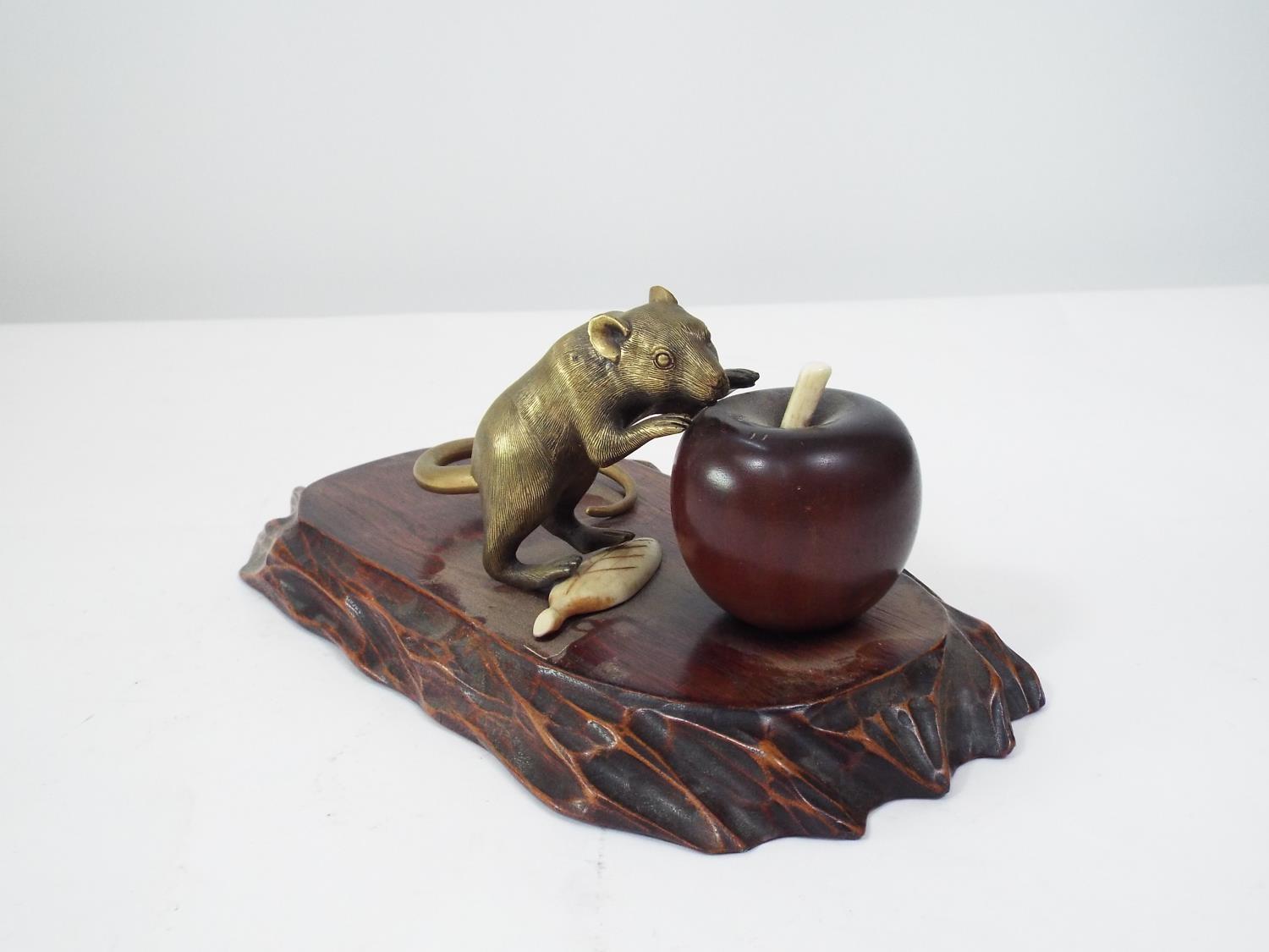 A Japanese group comprising a brass rat with gold tail, about to eat an apple, in turned wood, - Image 4 of 4