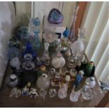 A collection of modern glassware of miniature form, mainly scent bottles, with paperweights and