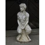 A partially weathered contemporary cast composition stone garden figure of pan in seated pose and