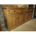 A pair of good quality Victorian style stripped pine side cupboards, each enclosed by a pair of