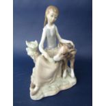 A Lladro figure of a girl feeding a calf