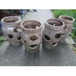 Four small matching terracotta oviform strawberry pots with moulded collars, 36 cm high