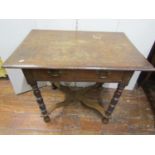 An 18th century oak side table with frieze drawer, raised on bobbin supports, united by an X