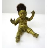 Good quality Victorian brass inkwell/nib wipe in the form of a seated boy, hands aloft, legs apart
