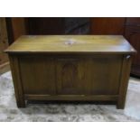 A Webber reproduction oak coffer/blanket chest with hinged lid, panelled frame and carved detail,