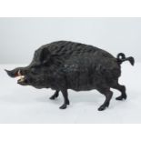 A 19th century bronze figure of a wild boar with painted features, 22 cm in length