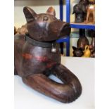 A carved hardwood figure of a recumbent hound, 40cm max