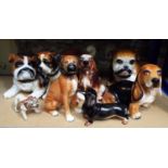 Eight various pottery figures including a Bulldog, Spaniel, St Bernard, Dachshund, etc, 28cm max