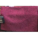 Shag pile type rug in purple, 240 x 160cm