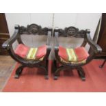 A pair of continental X framed chairs with carved finish