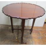 A good quality Edwardian mahogany folding occasional table in the Georgian manner, circular