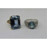 9ct blue spinel dress ring, size L and a further 9ct white gold blue spinel example, size M, 9.7g
