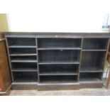 An Edwardian breakfront open bookcase, in three section, enclosing adjustable shelves, 190cm wide