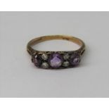 18ct amethyst and diamond ring with scrolled mount, size R/S, 3.5g