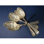 Set of six Victorian berry spoons with typical embossed scalloped bowls and engraved handles,