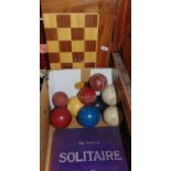 A mixed gaming lot comprising the game of Solitaire by Chad Valley, a folding fruit wood games board