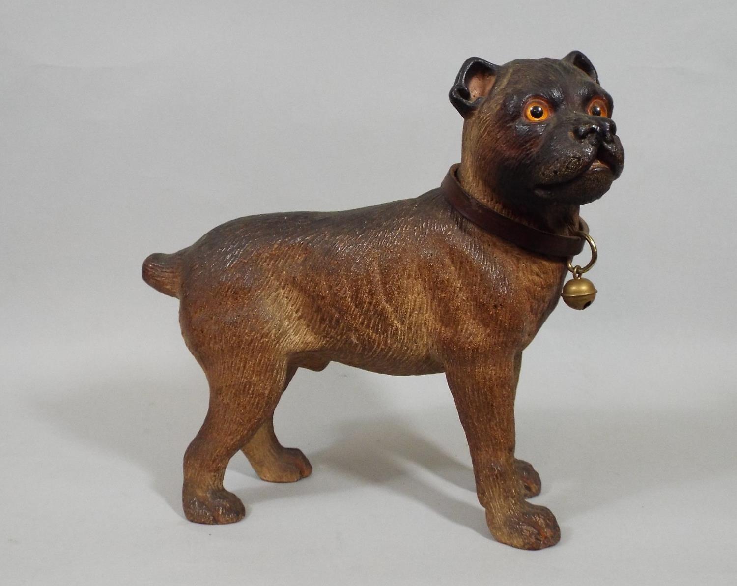 A Victorian pottery figure of a standing bulldog with leather collar and bell, 22 cm high