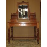 A late Victorian/Edwardian walnut dressing table, the central swing mirror with rectangular bevelled
