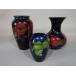 A Moorcroft vase of shouldered form with pomegranate and grape decoration and with impressed numbers