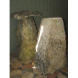 Two similar weathered natural stone staddle stone bases, one supporting a cap (AF), 70 cm high
