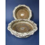 Matched pair of Georgian silver wine coasters with cast scallop shell and gadroon rims, turned