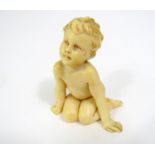 Late 19th century continental ivory carving of a seated naked child, legs tucked behind, leaning