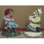A matched pair of vintage cast iron door porters in the form of Punch and Judy, with brightly