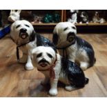 Three pottery figures - Old English sheepdogs, all seated, two 36 cm in height, one 24 cm in height