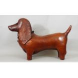 A good quality model of a Dachshund, with a mid-tan coloured leather finish, 60cm approx