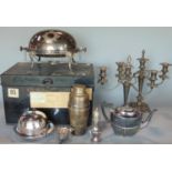 Collection of silver plate to include pair of candelabra, tea wares, cocktail shaker etc, in a