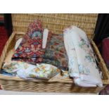 Large wicker hamper containing furnishing fabric remnants including waxed cotton by Jonelle