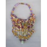 Unusual multi-gem drop necklace composed of polished and raw vari-cut beads to include citrine and